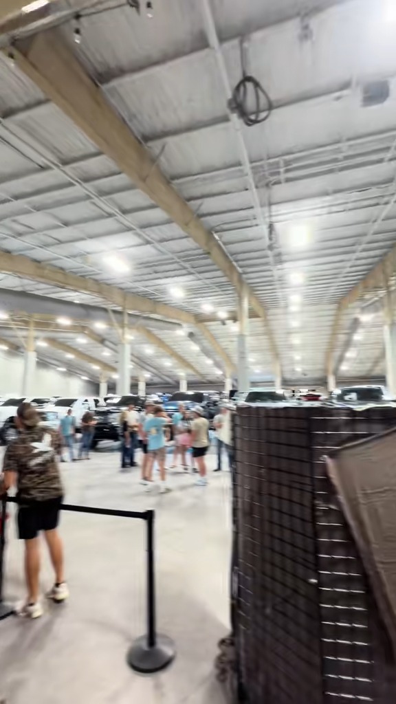 Show trucks and spectators inside the Platinum building