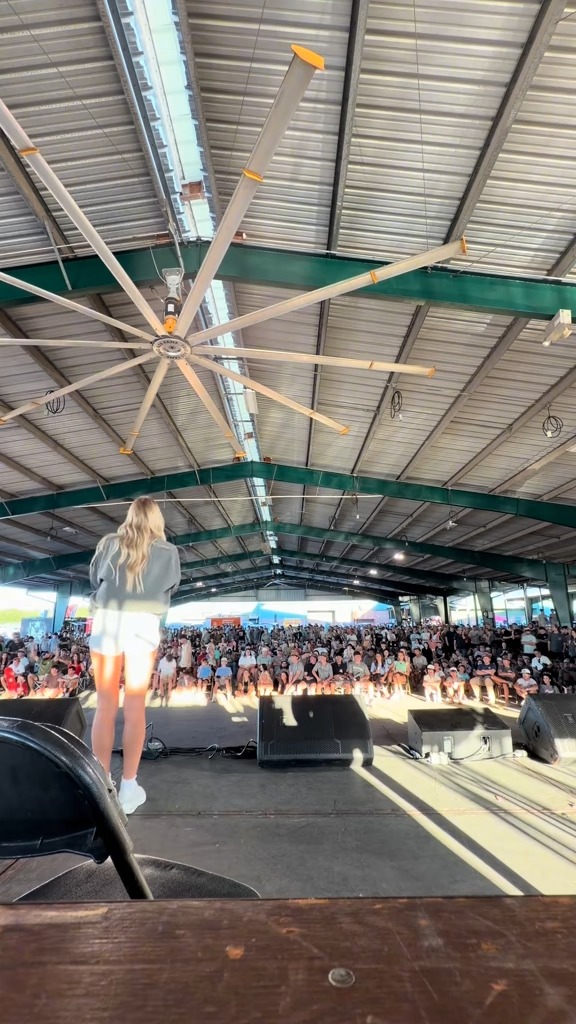 On stage facing a packed pavilion at the 2026 HardyCo Showdown